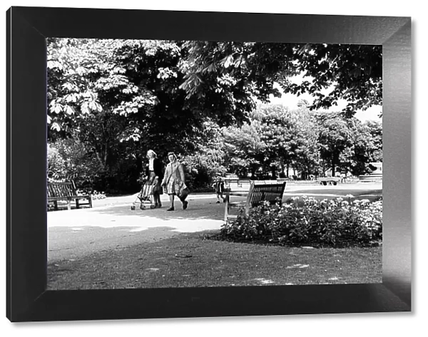 Two women and a child walking through Albert Park in Middlesbrough. 26th June 1979