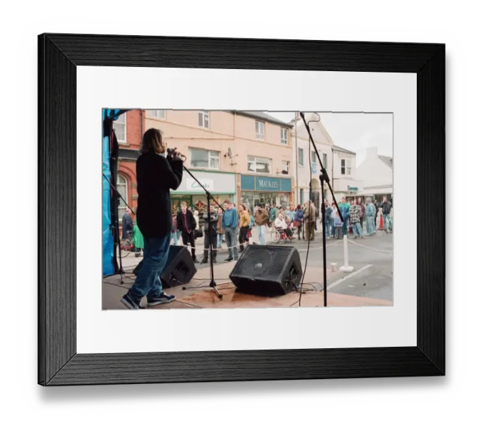 Framed Print : Rachel Horner of Velma entertaining the crown at the Redcar Free Festival to raise funds