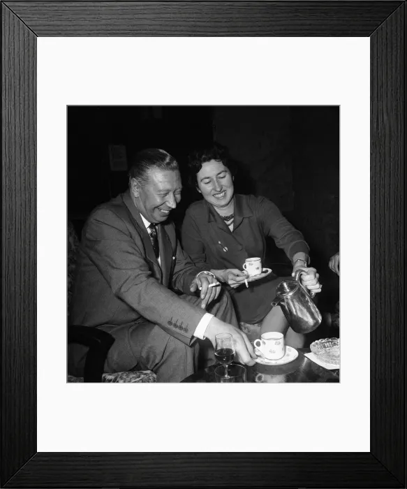 Framed Print : George Formby and fiancee Pat Howsen of Preston. She is wearing the huge solitaire Framed Print : George Formby and fiancee Pat Howsen of Preston. She is wearing the huge solitaire