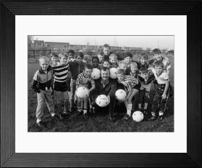 Framed Print : Getting their heads together for the benefit of soccer Framed Print : Getting their heads together for the benefit of soccer