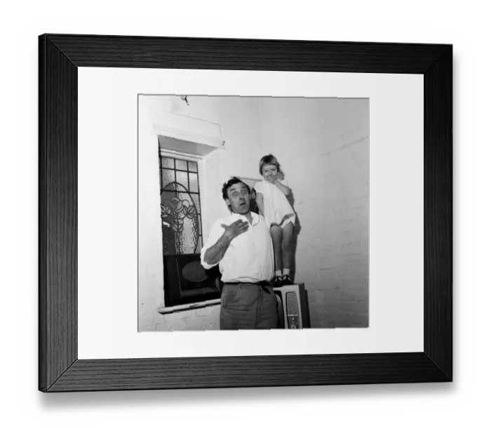 Framed Print : Spike Milligan with his three year old daughter Sile Milligan, pulling funny faces