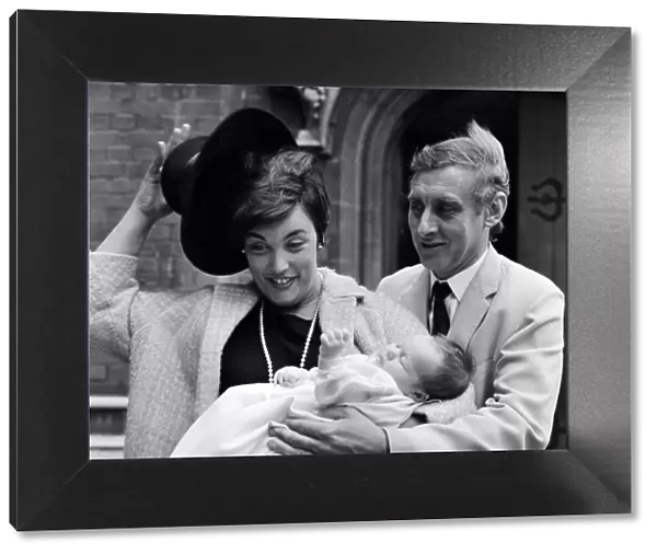Spike Milligan with wife Paddy holding their new arrival, Jane Fionulla Marion
