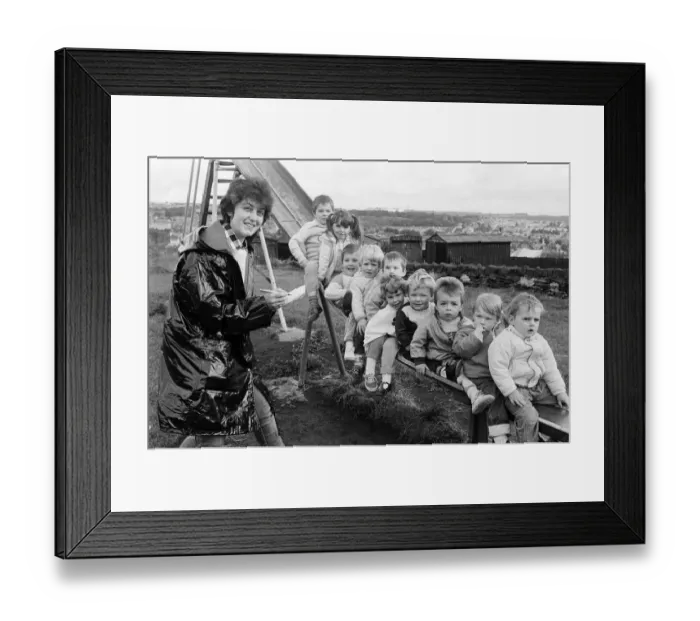 Framed Print : Sliding to fund-raising success are these children, who will be joining the new St