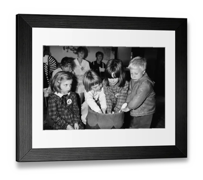 Framed Print : All hands into the lucky dip... trying their luck at a birthday bazaar organised for Framed Print : All hands into the lucky dip... trying their luck at a birthday bazaar organised for
