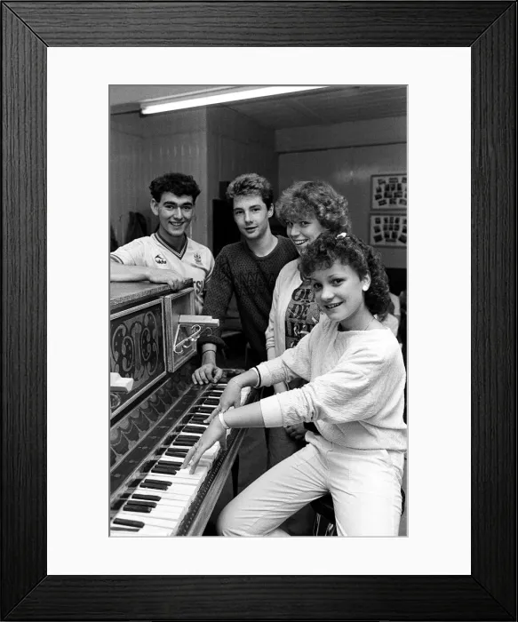 Framed Print : Rehearsing for a special production are Joanne Wilkinson at the piano with (from left