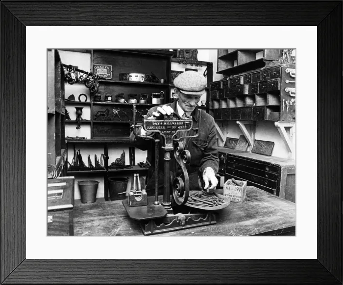 Framed Print : Jim Lloyd, museum attendant at Preston Park Museum, in the ironmongers shop Framed Print : Jim Lloyd, museum attendant at Preston Park Museum, in the ironmongers shop