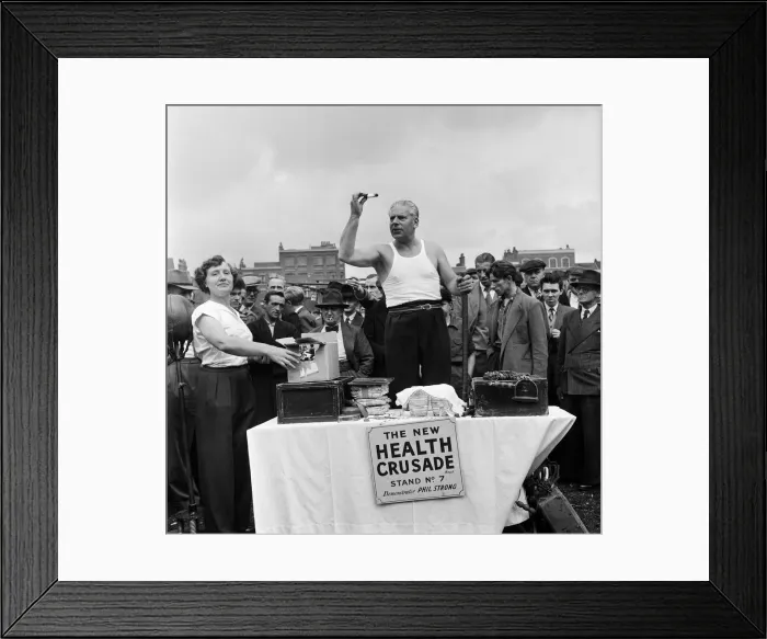 Framed Print : Phil Strongs medicine cures all, so he says as he sells it from his stall Framed Print : Phil Strongs medicine cures all, so he says as he sells it from his stall