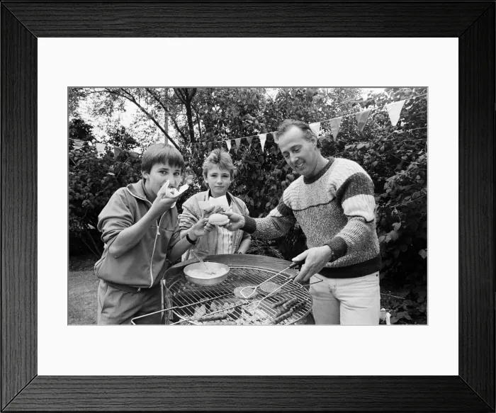Framed Print : Tasty... Trying out the hotdogs at a summer fete held in the grounds of Longdenholme old Framed Print : Tasty... Trying out the hotdogs at a summer fete held in the grounds of Longdenholme old