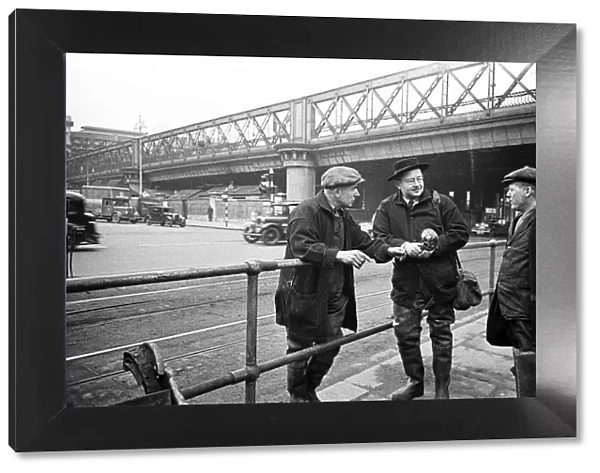 Daily Mirror photographer Bela Zola pictured in the centre