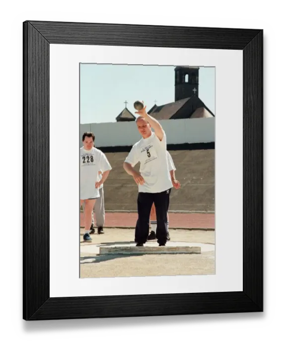 Framed Print : Shot put at the annual sports day at Clairville Stadium for people with special needs