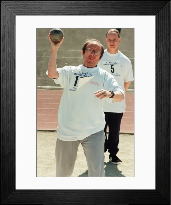 Framed Print : Shot put at the annual sports day at Clairville Stadium for people with special needs Framed Print : Shot put at the annual sports day at Clairville Stadium for people with special needs