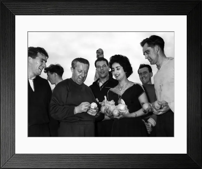 Framed Print : After finishing training the Wales football team received a case of oranges from Framed Print : After finishing training the Wales football team received a case of oranges from