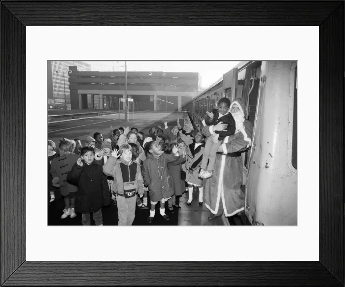 Framed Print : Father Christmas arriving at Snow Hill station yesterday being greeted by enthusiastic Framed Print : Father Christmas arriving at Snow Hill station yesterday being greeted by enthusiastic