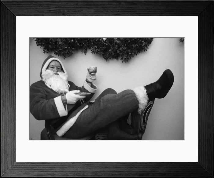 Framed Print : Father Christmas with a cup of tea in his grotto Birmingham. 23rd December 1988 Framed Print : Father Christmas with a cup of tea in his grotto Birmingham. 23rd December 1988