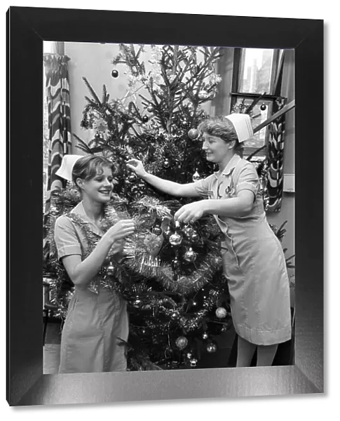 Nurses decorate a Christmas tree in Dudley Guest Hospital Birmingham