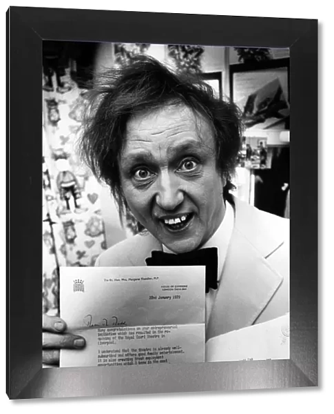 Ken Dodd hold a letter from Margaret Thatcher, congratulating him on his
