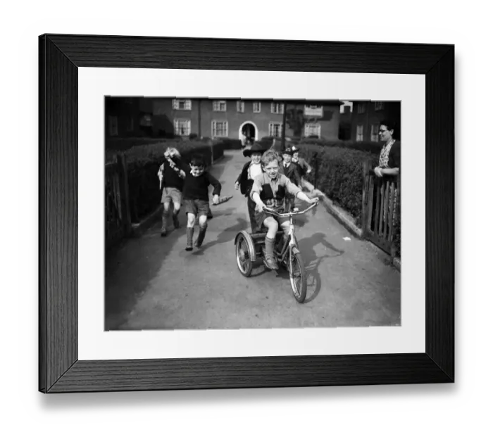 Framed Print : Boys playing on a council estate as one of their mothers looks on, London. 1955 Framed Print : Boys playing on a council estate as one of their mothers looks on, London. 1955