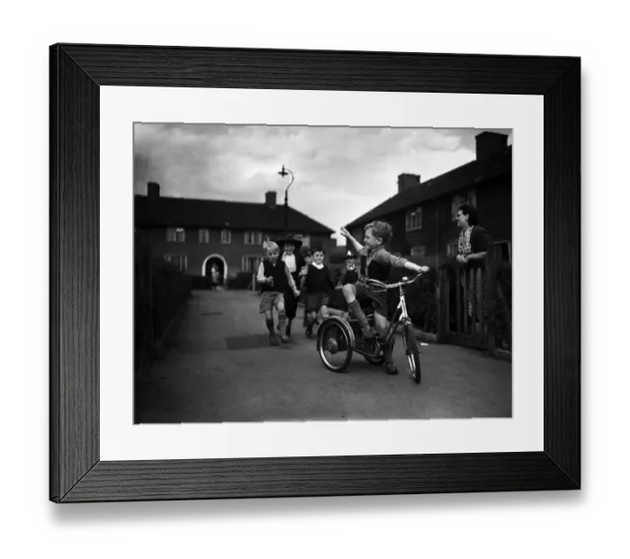Framed Print : Boys playing on a council estate as one of their mothers looks on, London, 1955
