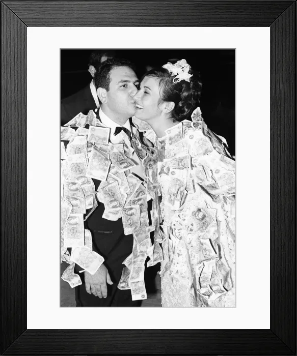 Framed Print : Elias Nicholas kisses his new bride and Katerina following the money dance at a Framed Print : Elias Nicholas kisses his new bride and Katerina following the money dance at a