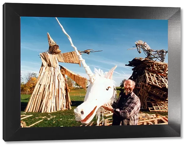 Sculptor, Phil Bews with his bonfire sculptures of a wizard and a unicorn