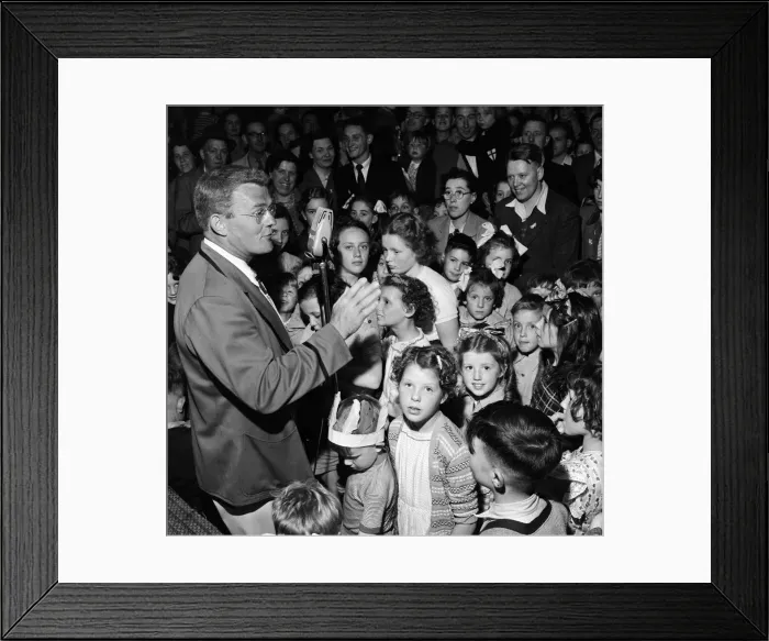 Framed Print : A Butlins Redcoat entertaining families at a Butlins Holiday Camp. June 1954 Framed Print : A Butlins Redcoat entertaining families at a Butlins Holiday Camp. June 1954