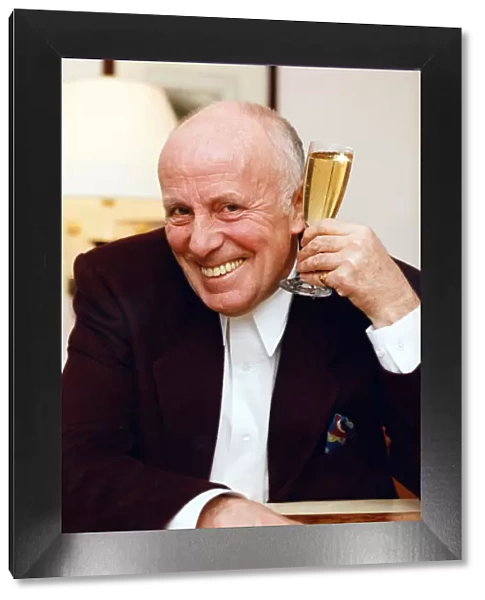 Actor Richard Wilson toasts the resounding successes of 1992. 29th December 1992