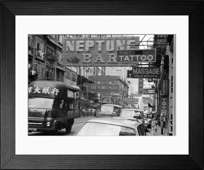 Framed Print : Traffic and signs advertising night clubs, tattoo and massage parlours seen here Framed Print : Traffic and signs advertising night clubs, tattoo and massage parlours seen here