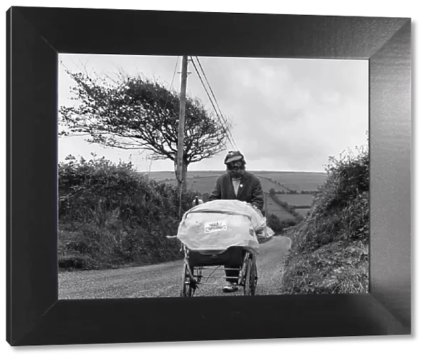 Gentleman of the road George Gibb seen here with his battered pram tramping the roads