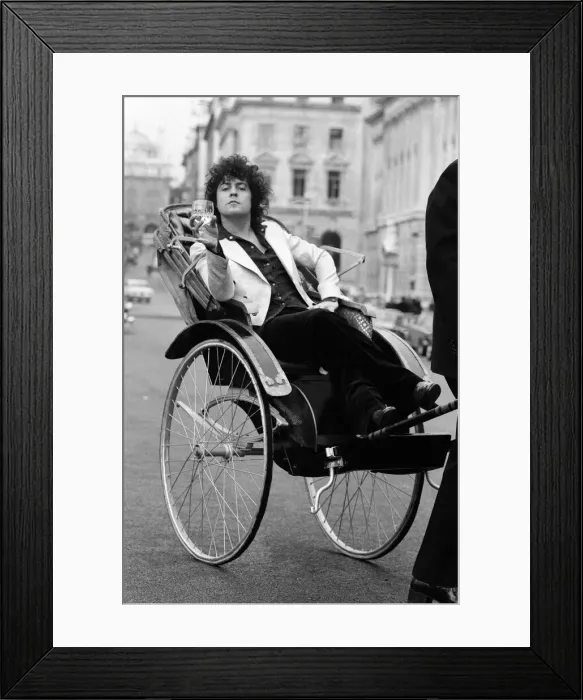Framed Print : Singer Marc Bolan in a rickshaw in London. Drawing the rickshaw is Alphie O Leary Framed Print : Singer Marc Bolan in a rickshaw in London. Drawing the rickshaw is Alphie O Leary