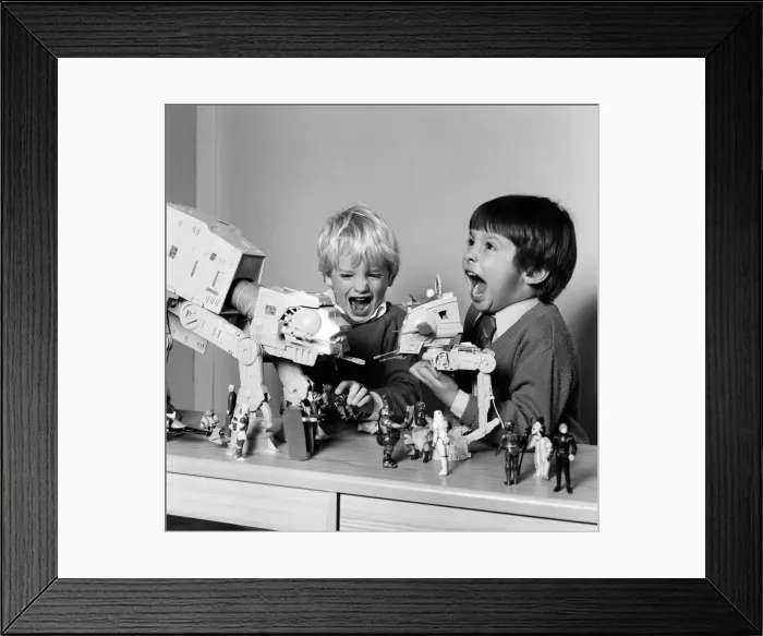 Framed Print : Two boys, Thomas (dark hair) and Robbin playing with their Star Wars toys Framed Print : Two boys, Thomas (dark hair) and Robbin playing with their Star Wars toys