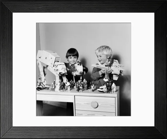 Framed Print : Two boys, Thomas (dark hair) and Robbin playing with their Star Wars toys Framed Print : Two boys, Thomas (dark hair) and Robbin playing with their Star Wars toys