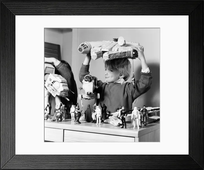 Framed Print : Two boys, Thomas (dark hair) and Robbin playing with their Star Wars toys