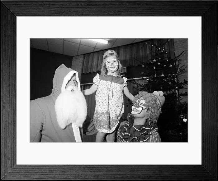 Framed Print : A clown and Father Christmas visiting Kemplah Primary School, Guisborough. December 1985 Framed Print : A clown and Father Christmas visiting Kemplah Primary School, Guisborough. December 1985