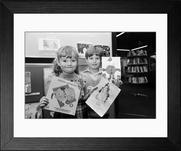 Framed Print : Children holing their entries for a Christmas card competition. Teesside, December 1985 Framed Print : Children holing their entries for a Christmas card competition. Teesside, December 1985