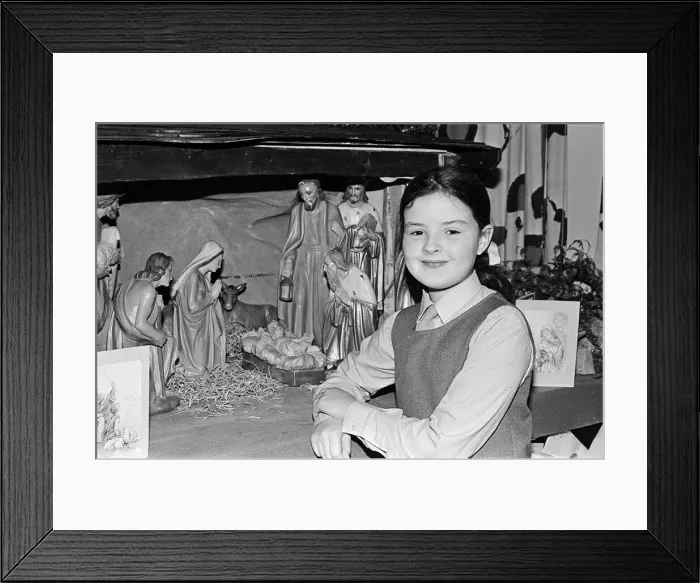 Framed Print : A young girl standing next to a Christmas Nativity scene. Teesside, December 1985 Framed Print : A young girl standing next to a Christmas Nativity scene. Teesside, December 1985