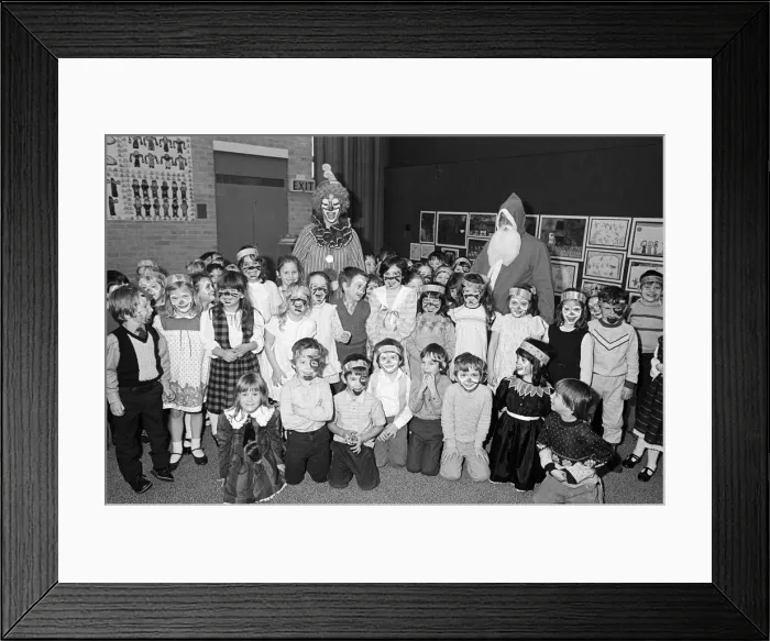 Framed Print : A clown and Father Christmas visiting Kemplah Primary School, Guisborough. December 1985 Framed Print : A clown and Father Christmas visiting Kemplah Primary School, Guisborough. December 1985