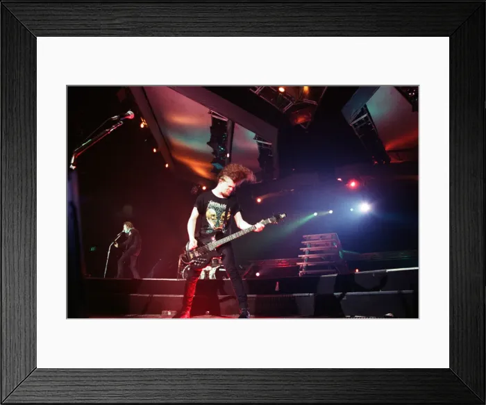 Framed Print : Metallica in concert at the NEC Arena, Birmingham. Jason Newsted Framed Print : Metallica in concert at the NEC Arena, Birmingham. Jason Newsted