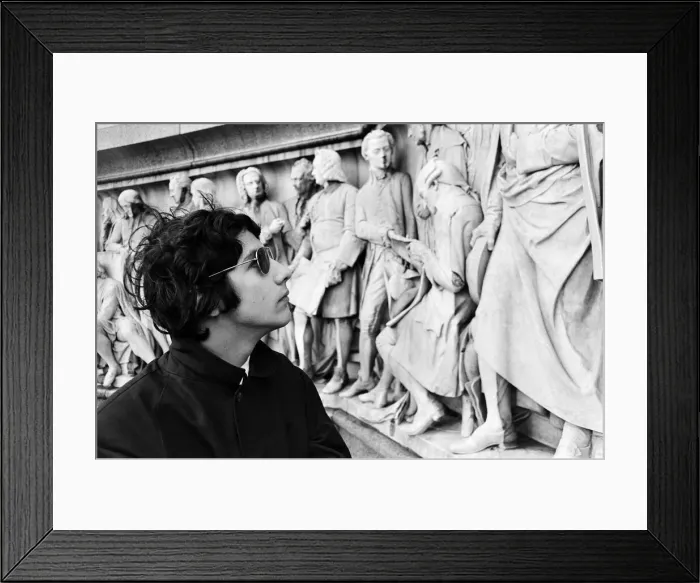 Framed Print : Young pop stars gathered at the Albert Memorial in London for a bread and water lunch to draw attention to Oxfams Christmas appeal. Pictured, Cat Stevens looking at the frieze encircling the podium of the Albert Memorial. 8th December 1966