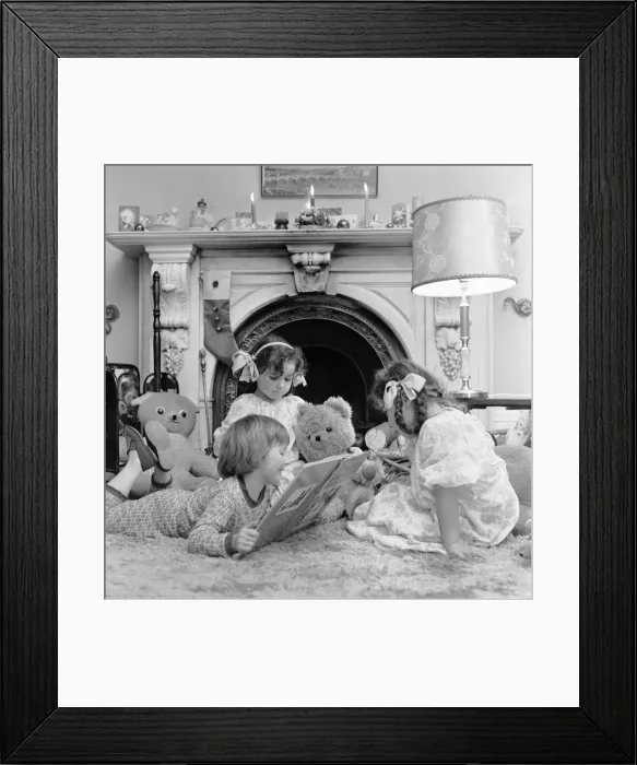 Framed Print : Christmas Eve, Children reading bedtime stories as they wait for Santa, Newcastle Framed Print : Christmas Eve, Children reading bedtime stories as they wait for Santa, Newcastle