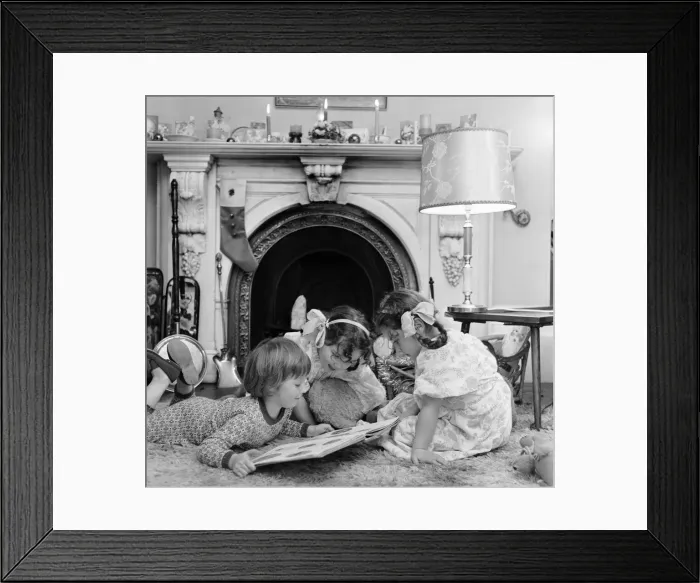 Framed Print : Christmas Eve, Children reading bedtime stories as they wait for Santa, Newcastle Framed Print : Christmas Eve, Children reading bedtime stories as they wait for Santa, Newcastle