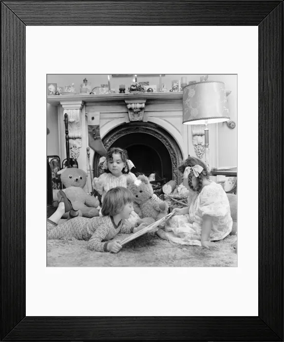 Framed Print : Christmas Eve, Children reading bedtime stories as they wait for Santa, Newcastle Framed Print : Christmas Eve, Children reading bedtime stories as they wait for Santa, Newcastle