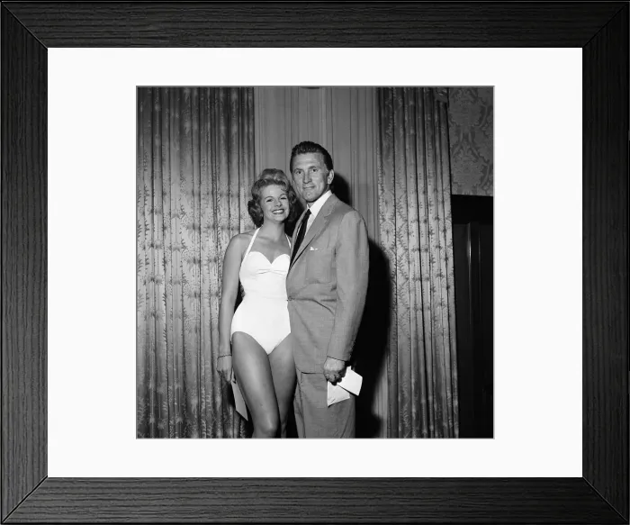 Framed Print : Kirk Douglas selects 21-year-old Marilyn Davies as the winner of the Viking Beauty