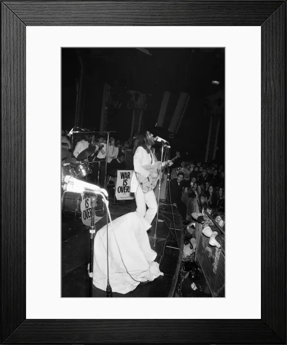 Framed Print : John Lennon and Yoko Ono on stage at the Lyceum. John was playing live for Framed Print : John Lennon and Yoko Ono on stage at the Lyceum. John was playing live for