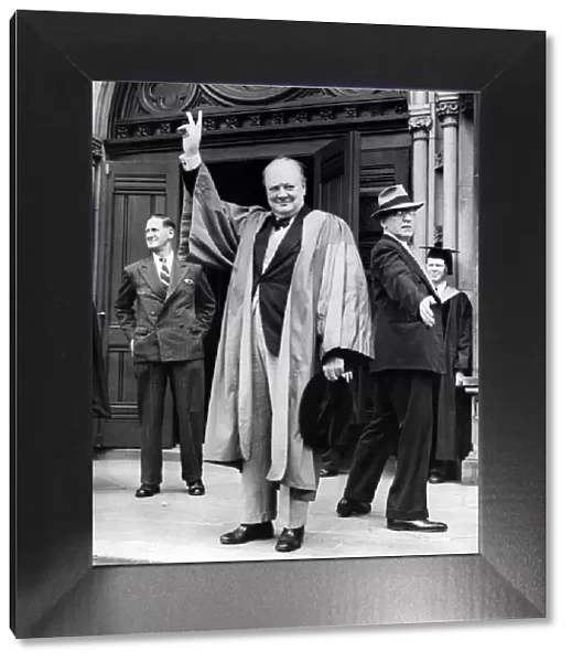 British Prime Minister Winston Churchill gives the famous V Sign in acknowledgement to