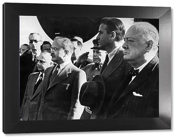 British Prime Minister Winston Churchill stands alongside First Deputy Premier of