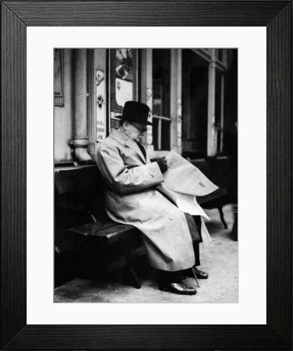 Framed Print : British Prime Minister Winston Churchill reading a newspaper on the platform at St