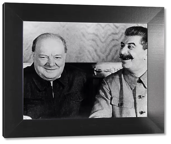 British Prime Minister Winston Churchill shares a joke with Soviet leader Josef Stalin