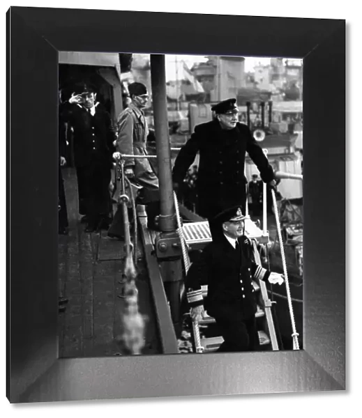 British Prime Minister Winston Churchill leaves a destroyer depot during his visit to