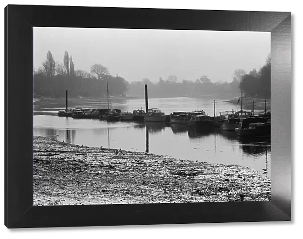 Boats on the River Thames in Kew, London. 5th March 1971