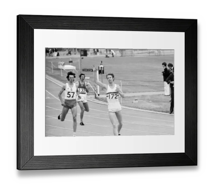 Framed Print : David Jenkins of Great Britain running through the tapes, arms in the air